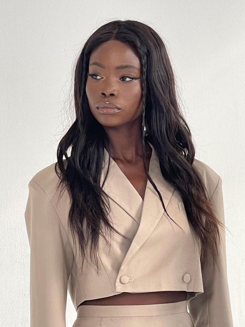 Model in a pale cropped jacket from the brand’s debut apparel campaign