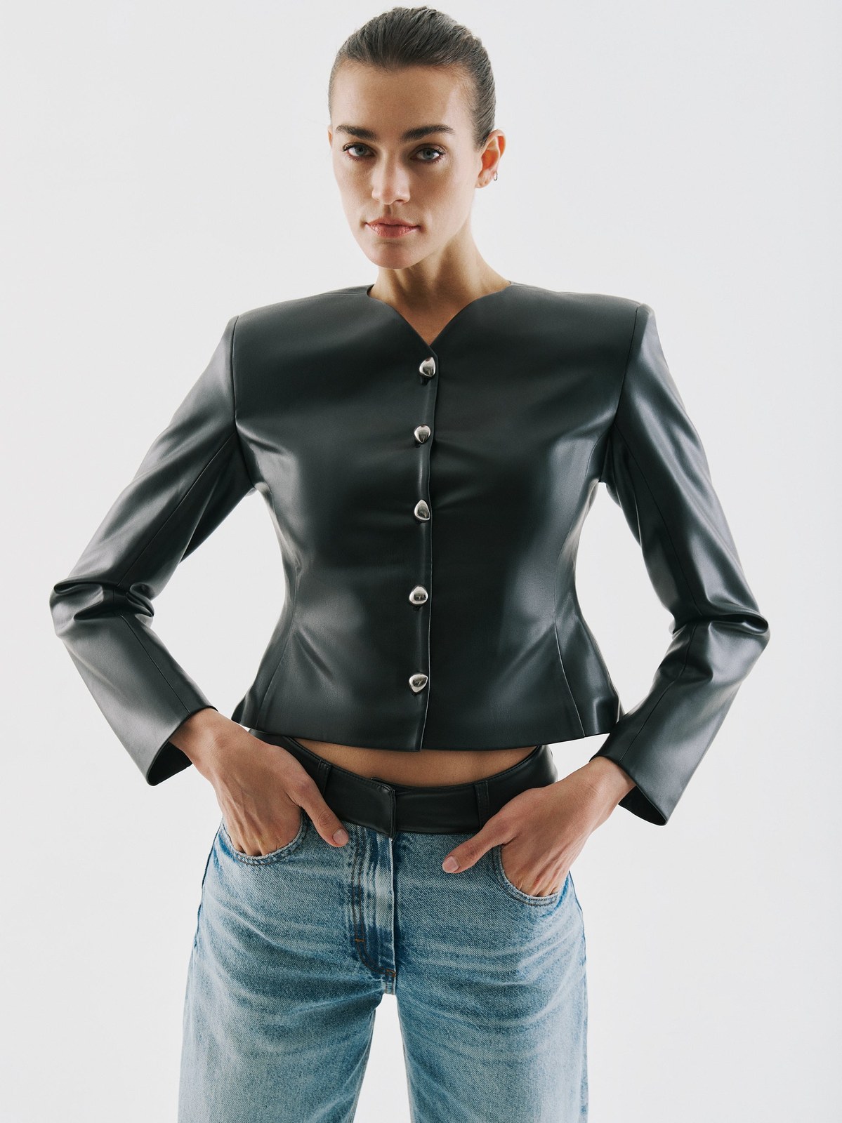 Model in a dark leather jacket and denim from the Fall Winter lookbook
