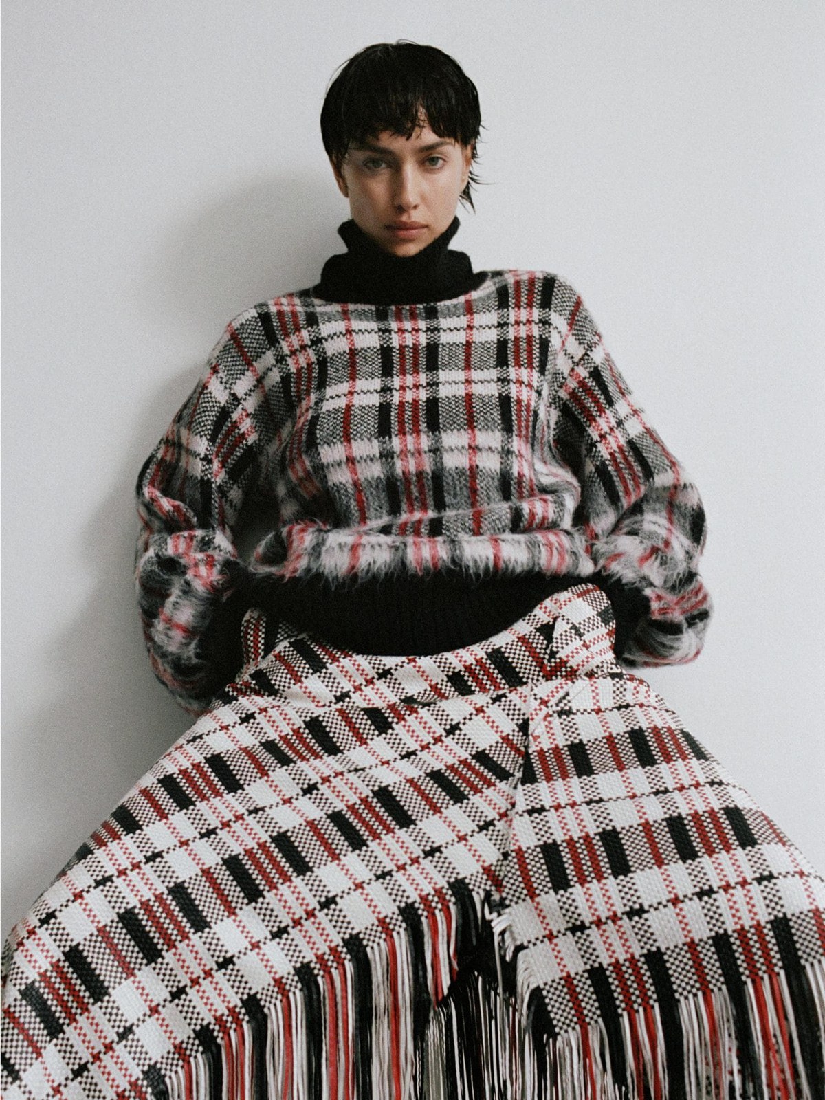 Irina Shayk in a patterned knit and matching fringed skirt