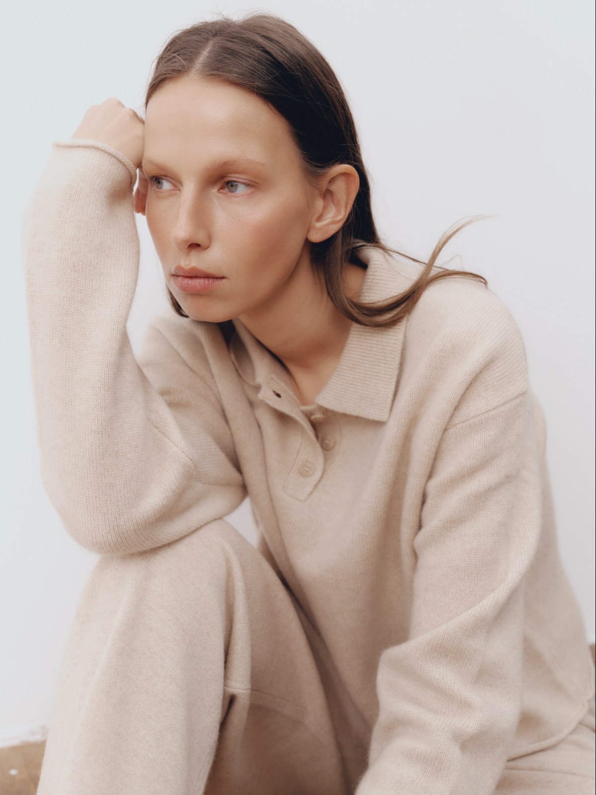 Model in a soft oat cashmere sweater and matching pants
