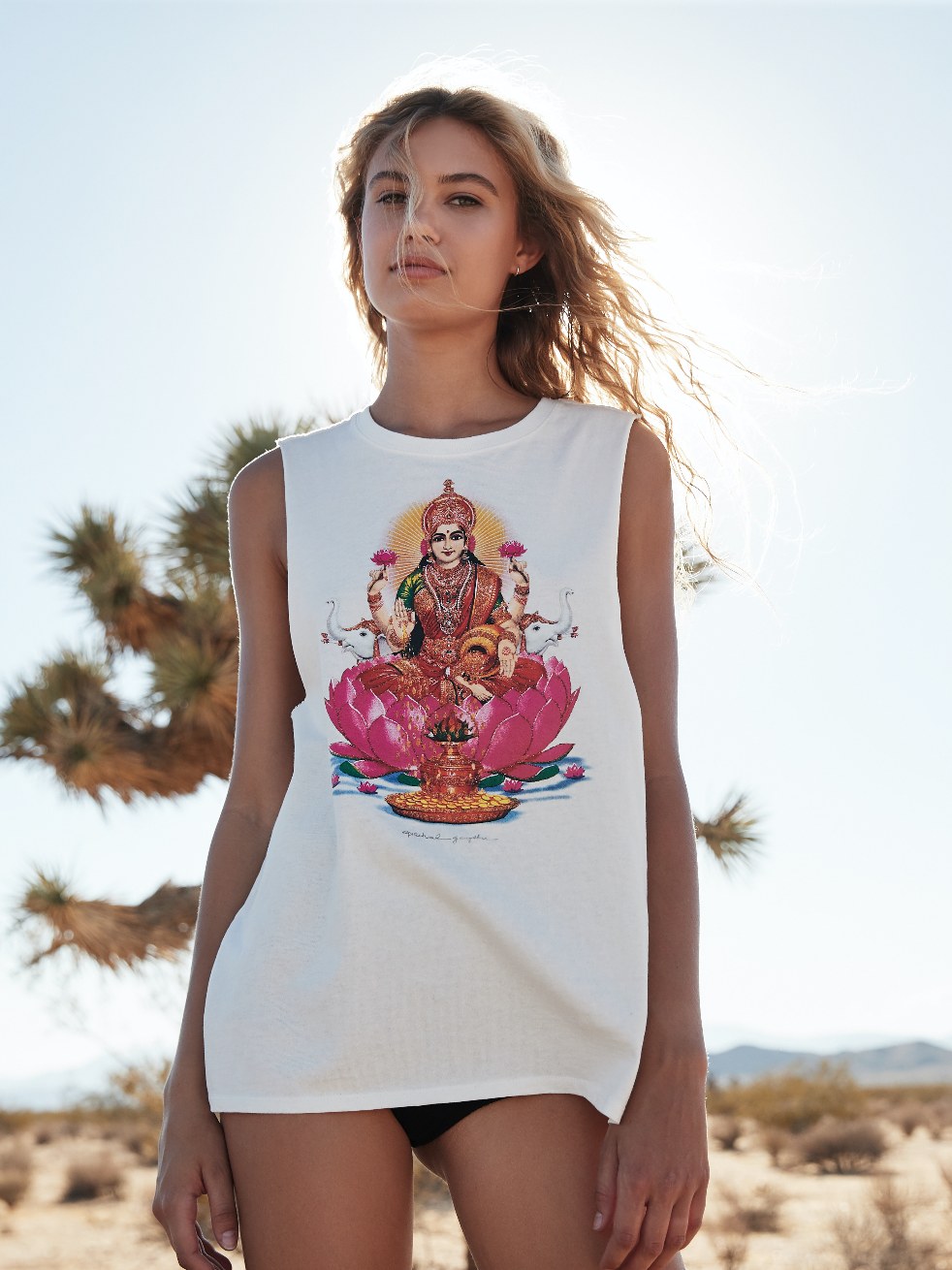 Woman in a graphic tank in the desert sunlight