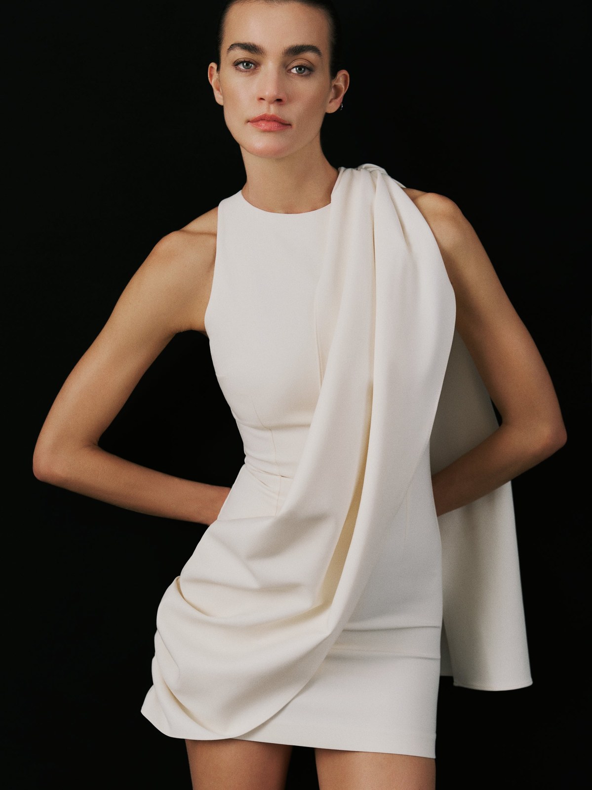 Model in a sculptural white dress from the Fall Winter lookbook