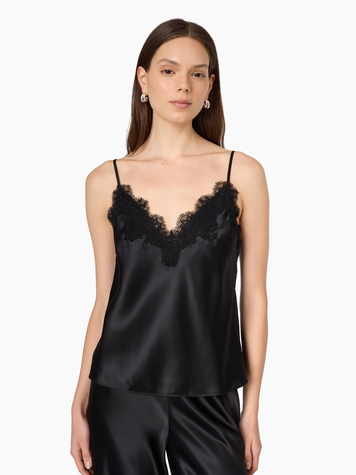 Model in an ivory lace trim silk camisole