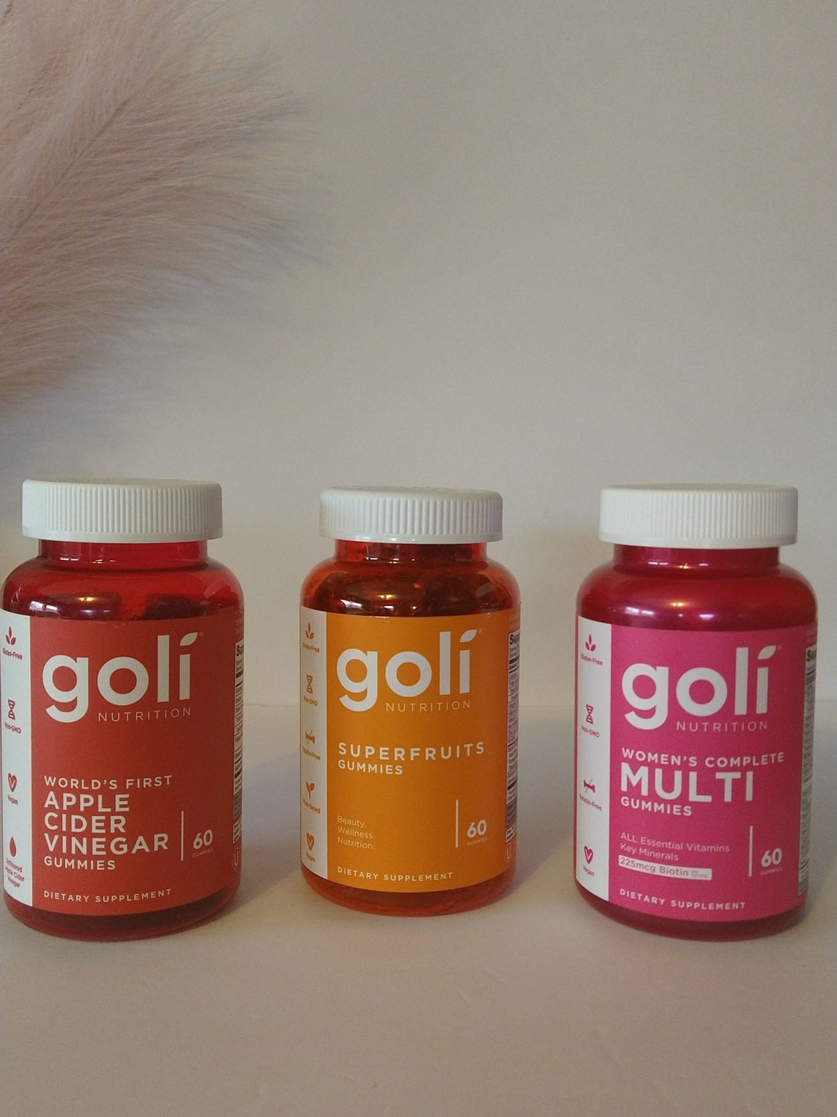Three Goli Nutrition bottles in a row: Apple Cider Vinegar, SuperFruits and Women's Complete Multi gummies