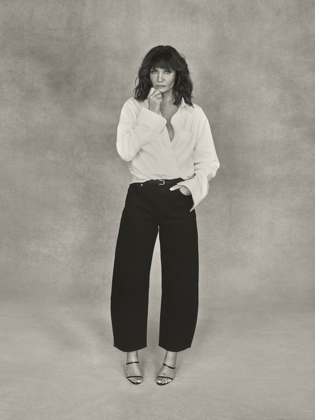 Helena Christensen in dark ROLLA'S jeans and a white blouse