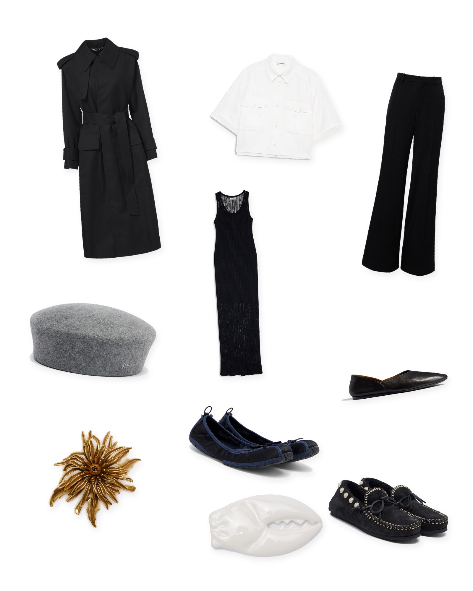Flat lay of a black trench coat, an ivory short-sleeve shirt, a long black knit dress, black wide-leg trousers, a gray felt hat, a gold brooch, a white claw brooch and black flat shoes on white.
