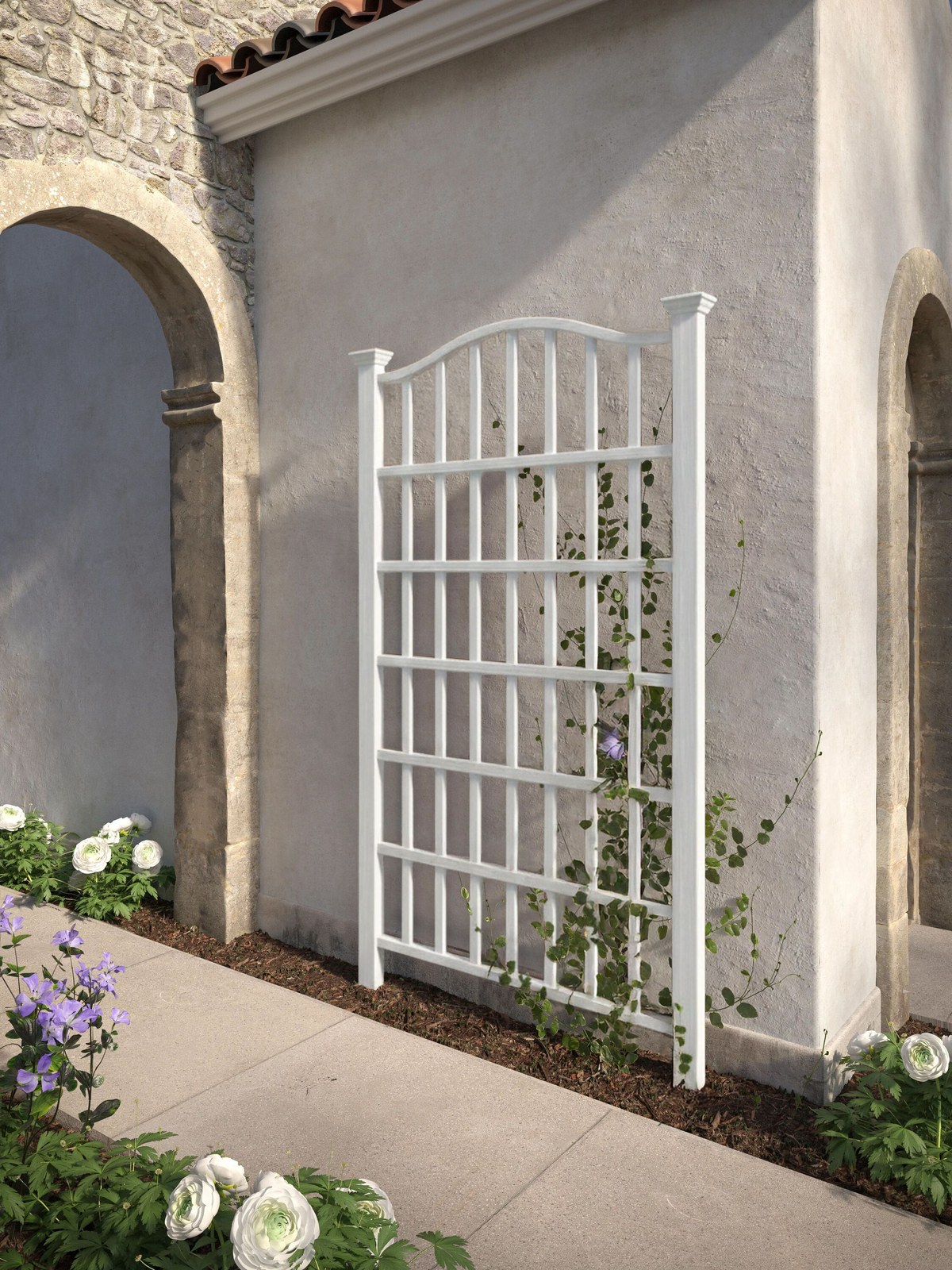 White lattice trellis panel against a stone wall beside an arched doorway