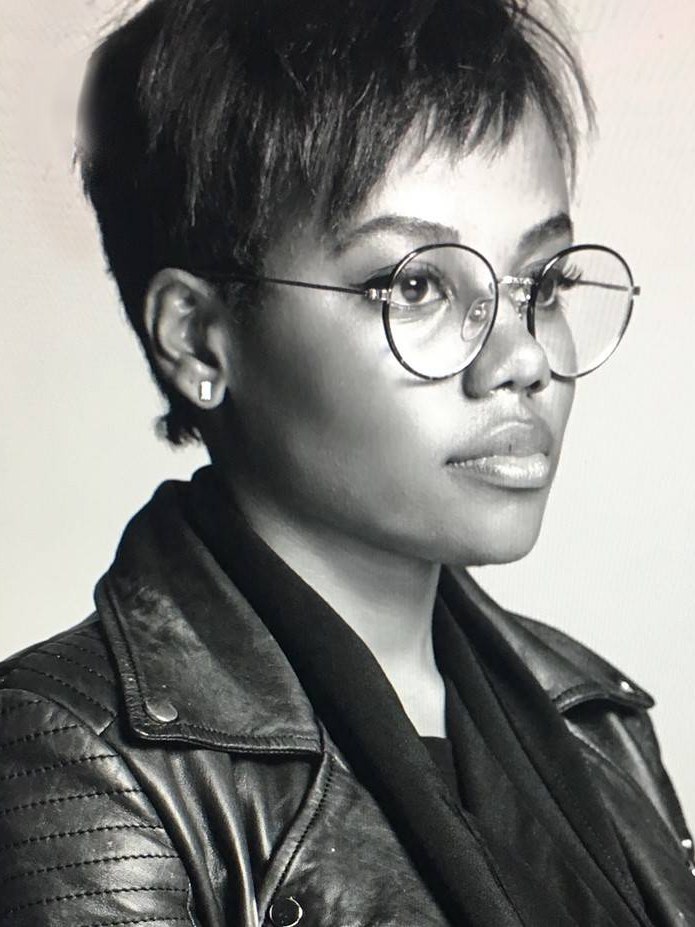 Makeup artist Cherish Brooke Hill in a black-and-white portrait