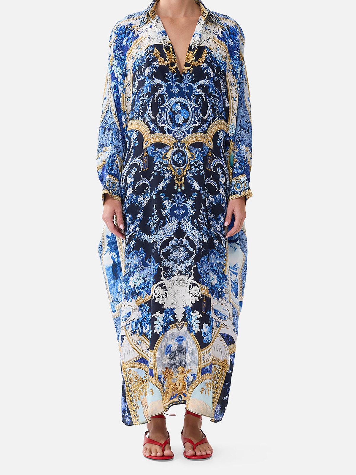 Model in a blue and gold printed silk wing collar kaftan