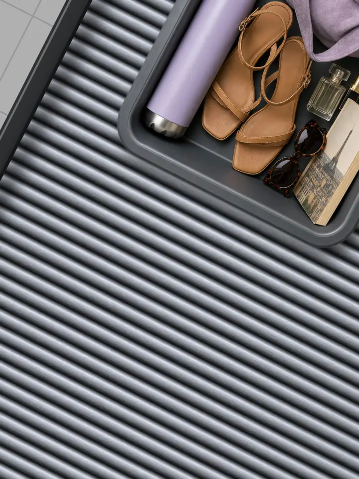 Phia ad: packed airport security trays for a Paris weekend, a beach week and a work trip slide down a conveyor. Let Phia do the packing for you. Install your free digital closet today.