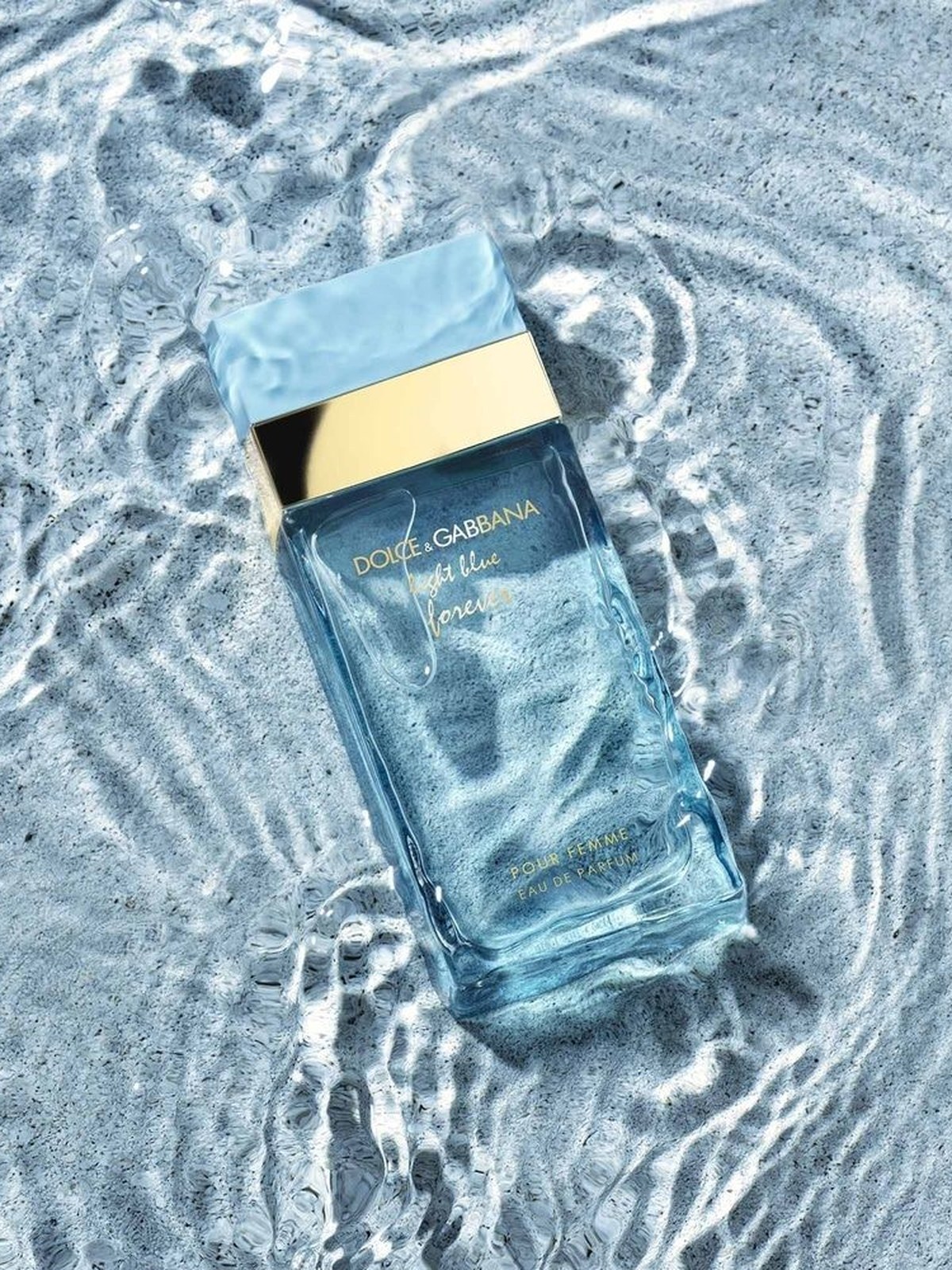 Dolce&Gabbana Light Blue Forever Eau de Parfum bottle floating in rippling pale blue water