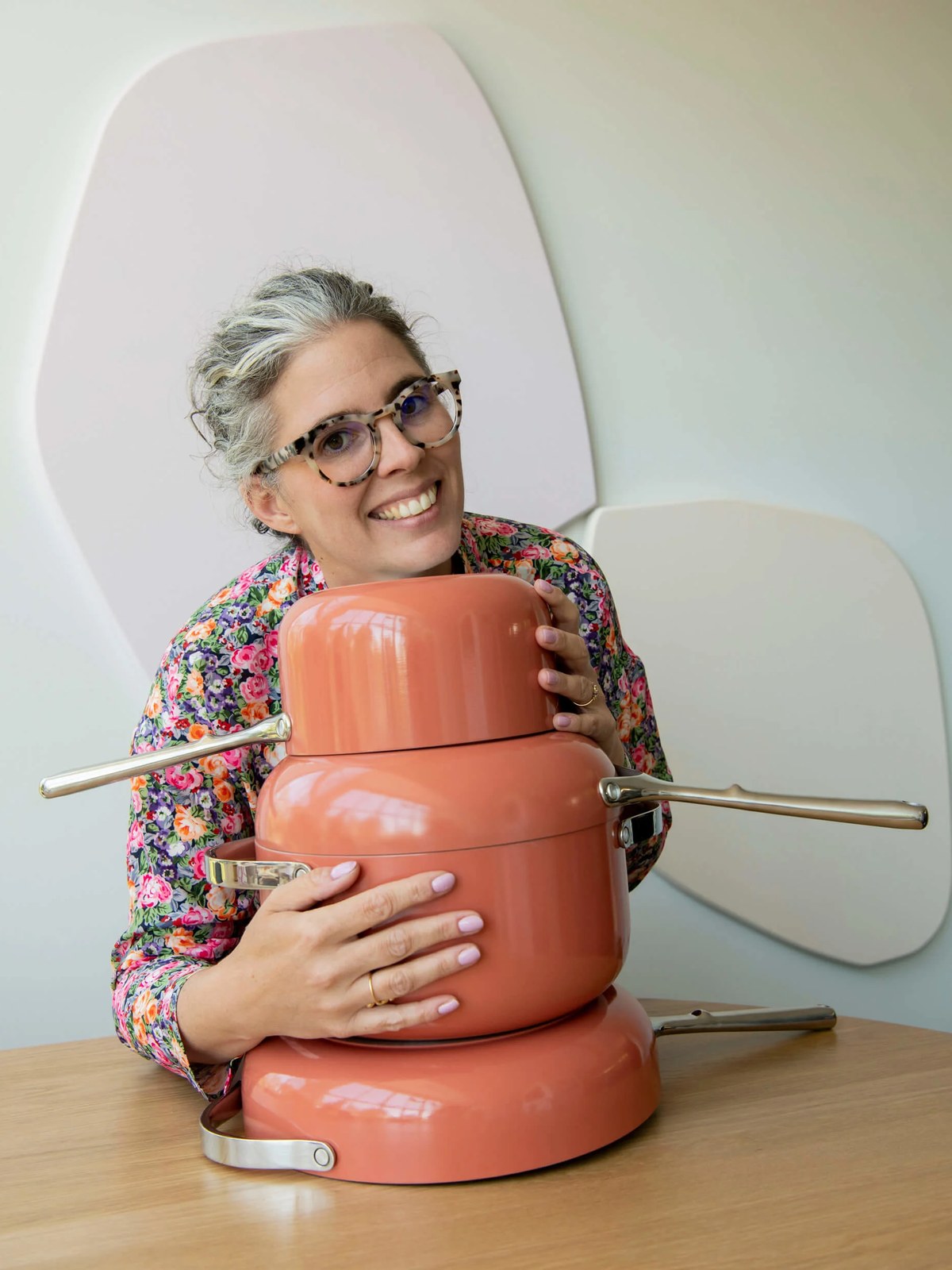 Alex Proba holding Perracotta cookware in a styled studio