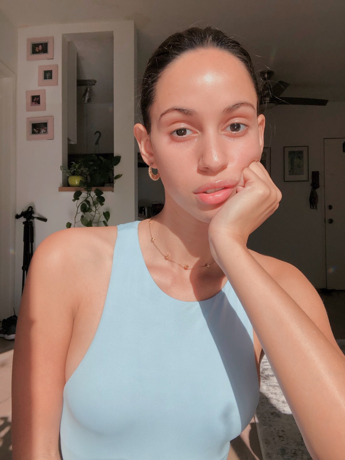 Taina Madera in a softly lit home setting
