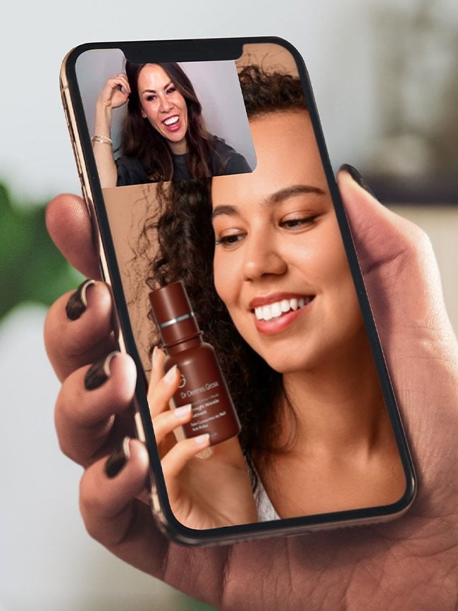 Woman smiling during a video skincare consultation