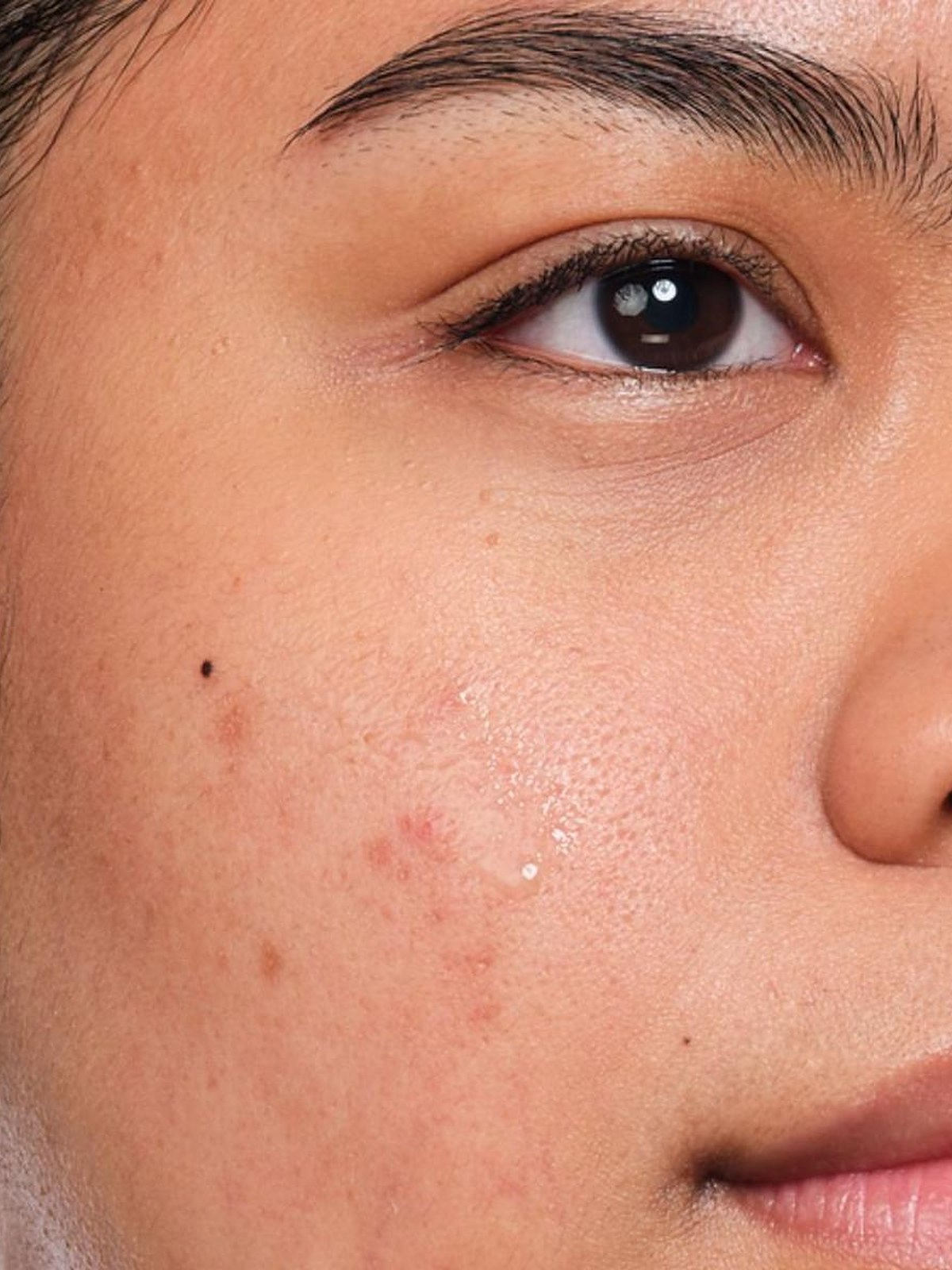 Close up of a woman's face with clear skin