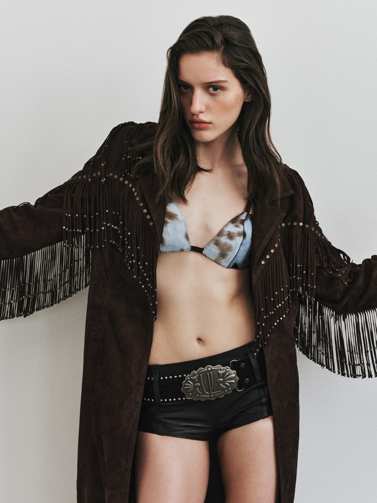 Model wearing a fringed jacket from Understated Leather’s Fall 2026 campaign