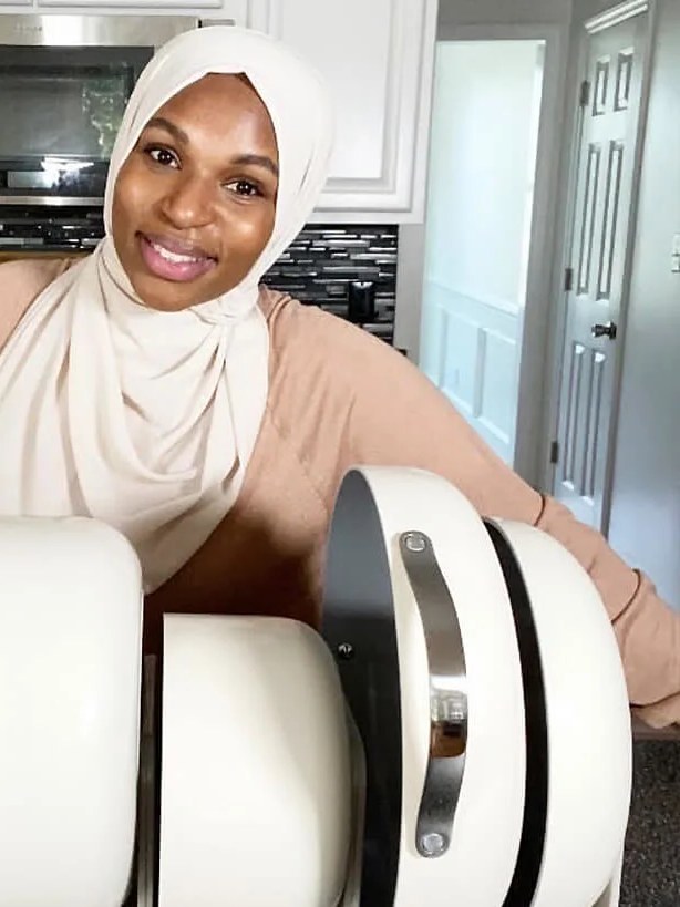 Saida Hussein with Caraway kitchenware in a home kitchen