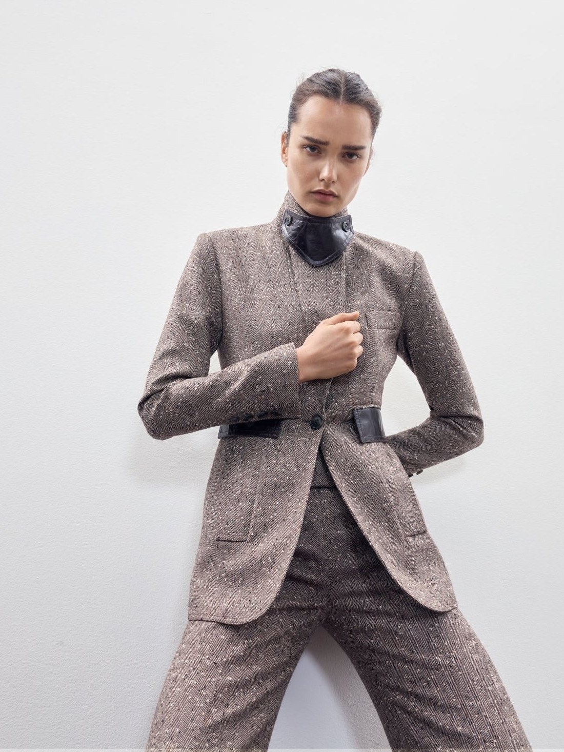 Model in a structured Smythe blazer within a quiet office set