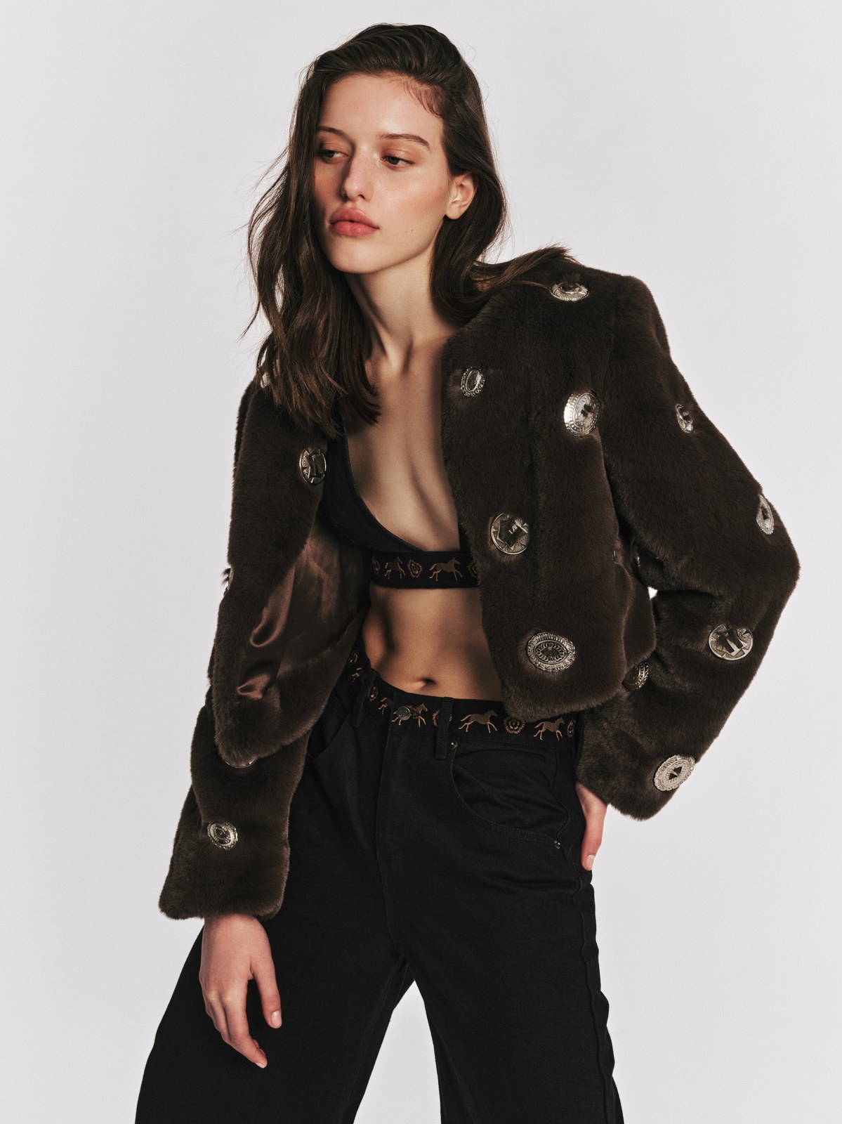 Model in a dark textured jacket from Understated Leather’s Fall 2026 campaign