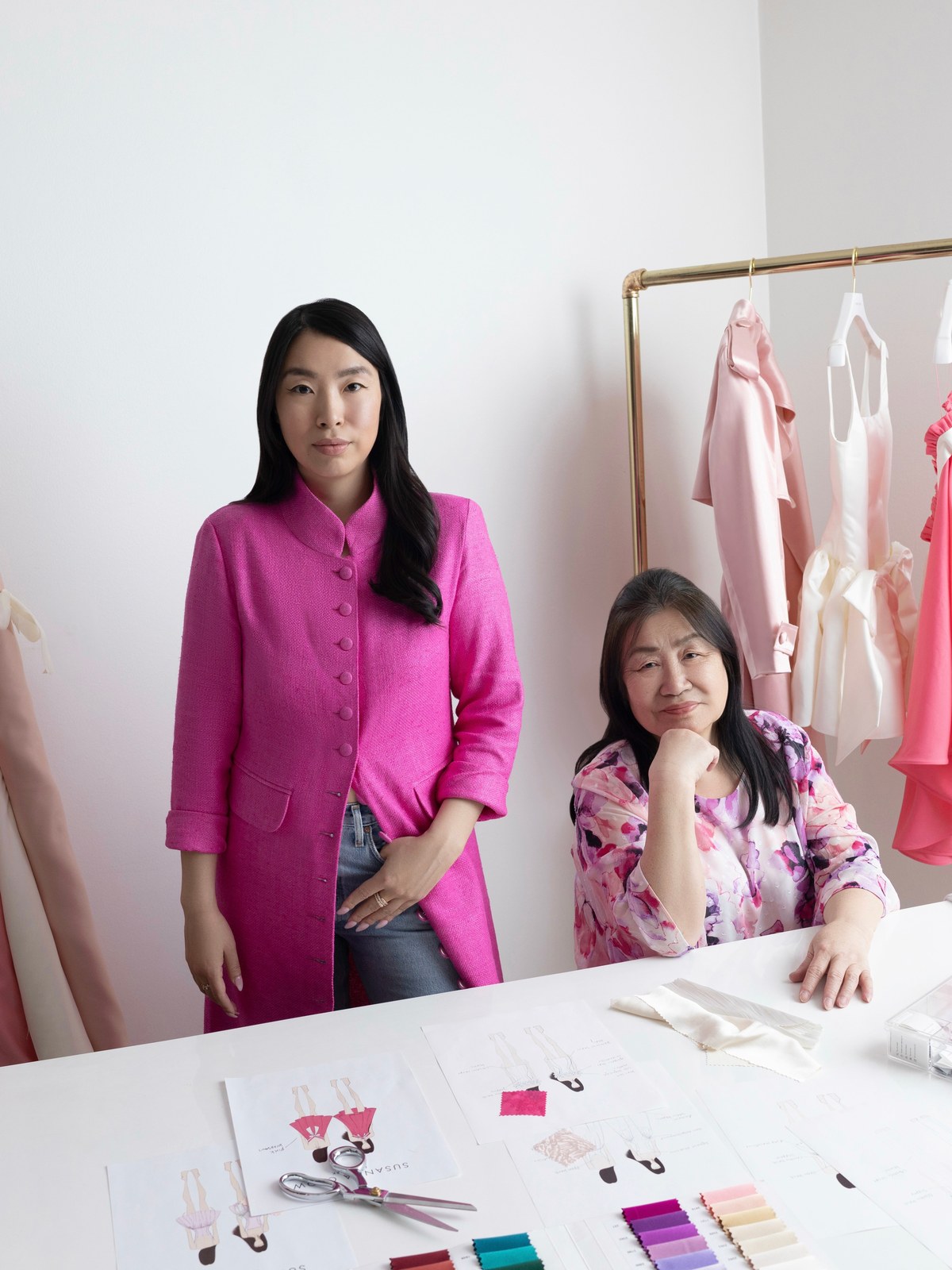 Susanna and Sai Chow working together at a design table
