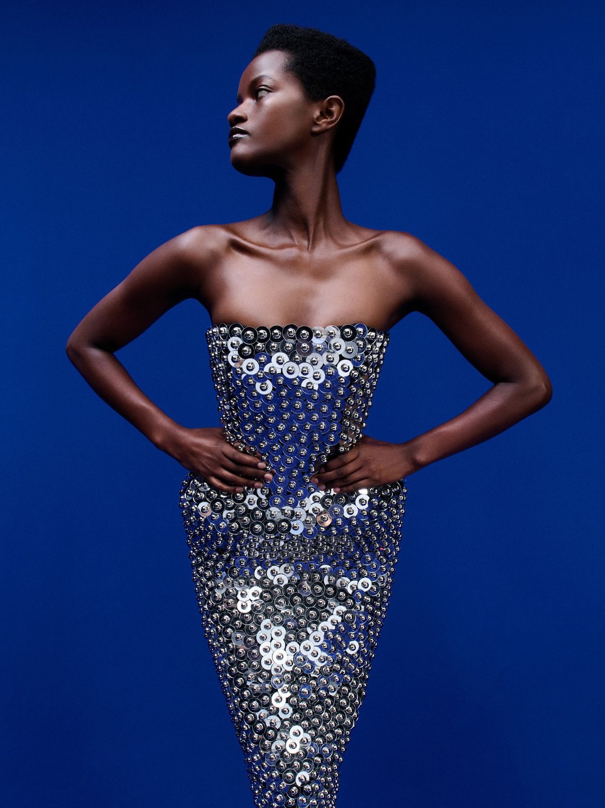 Runway model in a silver crystal-embellished dress