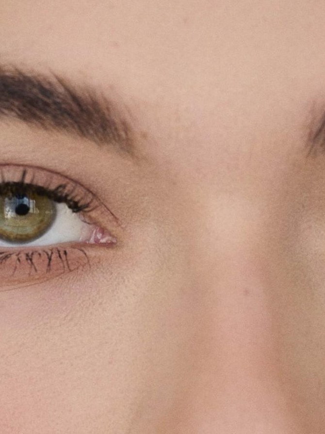 Close beauty portrait showing defined lashes and softly shaded eyes