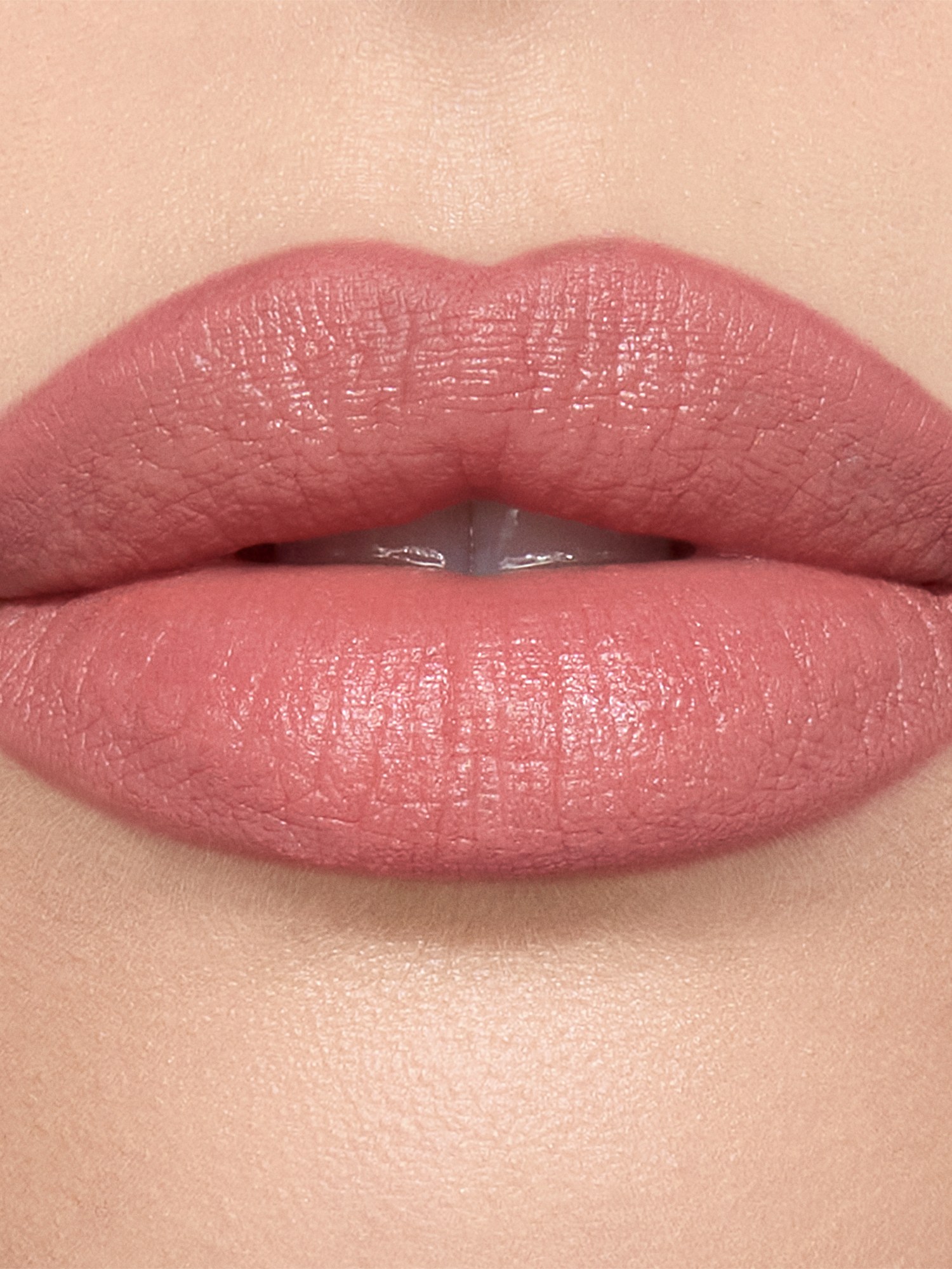 Close-up of lips in Pillow Talk nude pink lipstick
