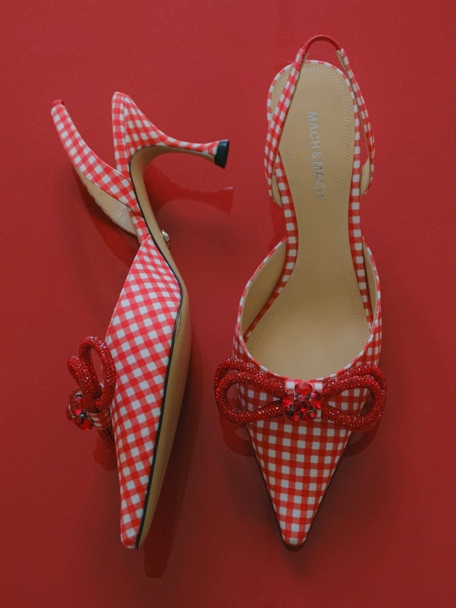 Red gingham bow slingbacks on a red background