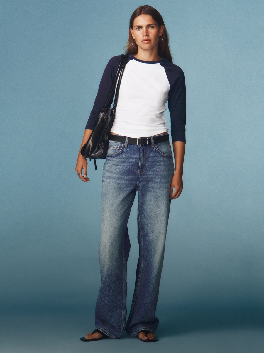 Cotton On campaign photo of a woman in a raglan tee and wide leg jeans