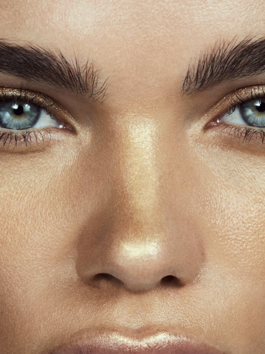 Close-up campaign portrait of a model with luminous skin