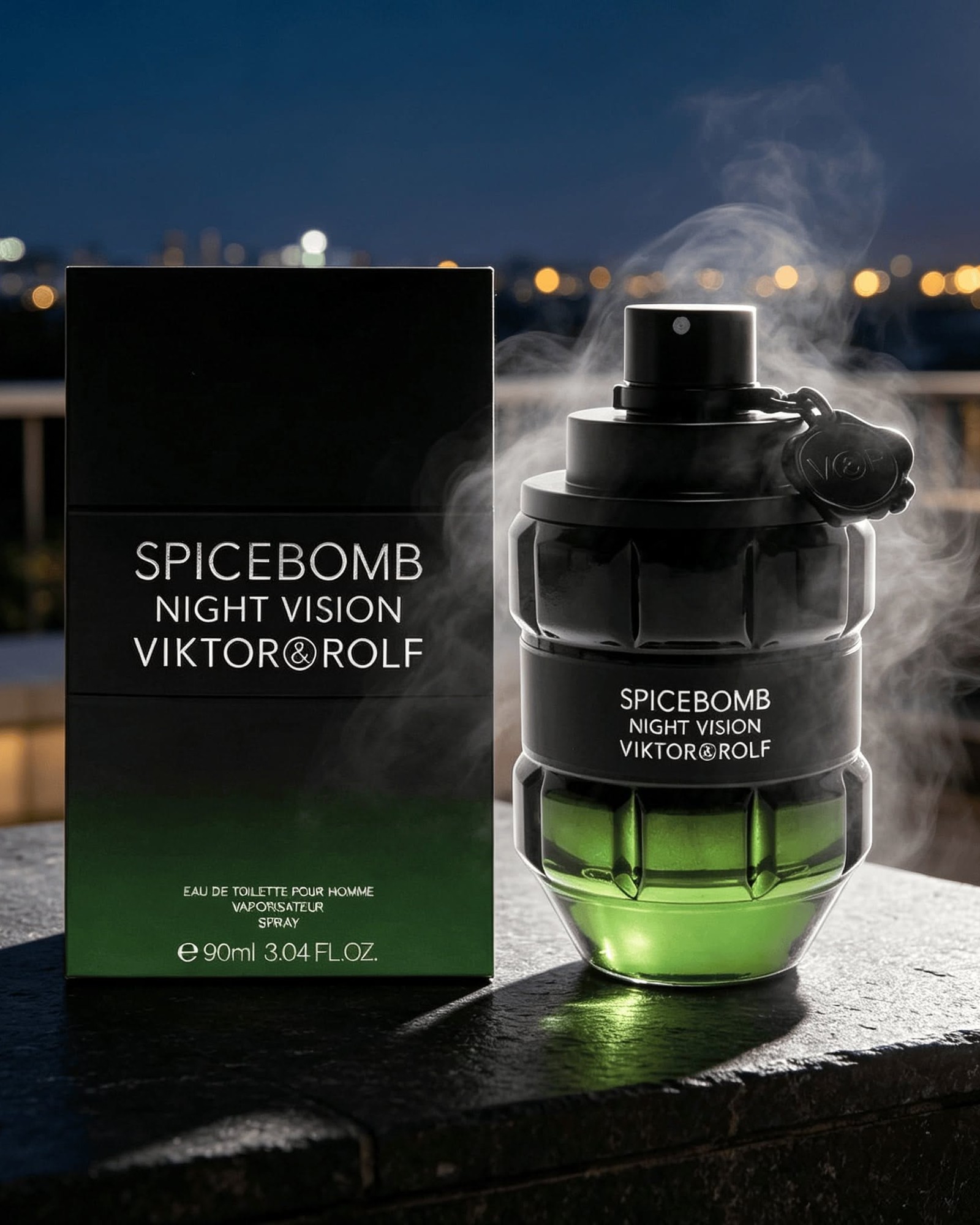 Spicebomb Night Vision bottle with black box on a stone ledge at night, smoke rising and city lights behind