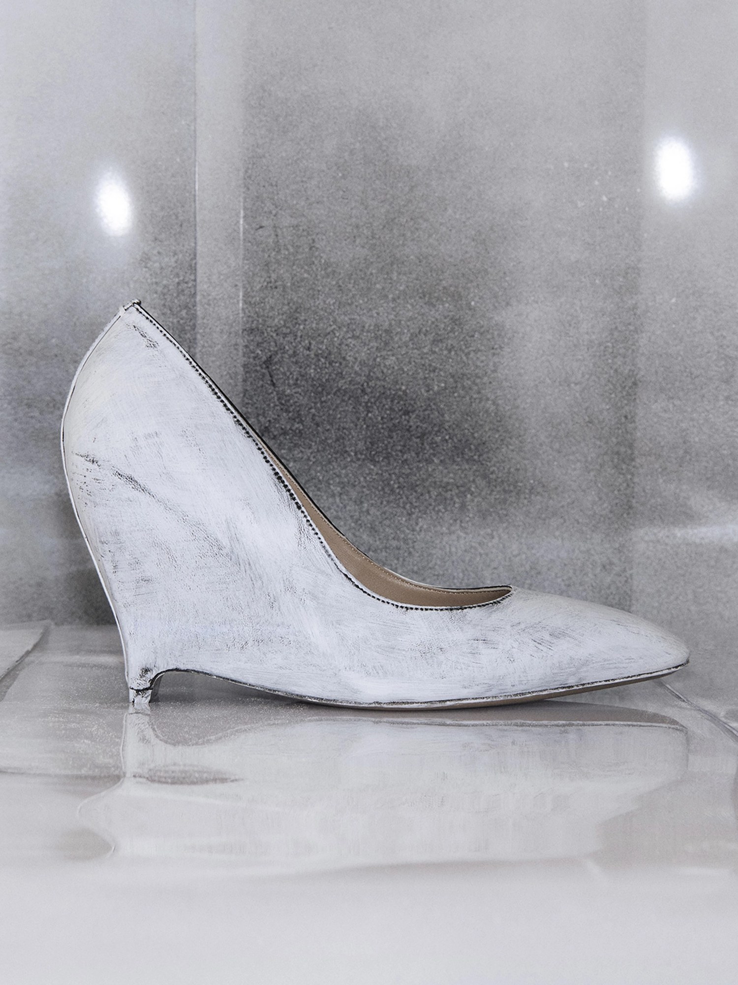 White painted heelless wedge pump