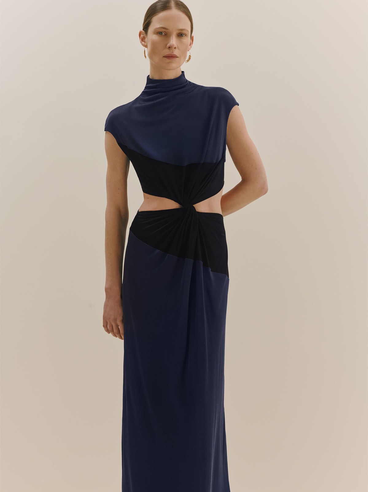 Model in a navy and black cutout dress for Bevza Fall 2026