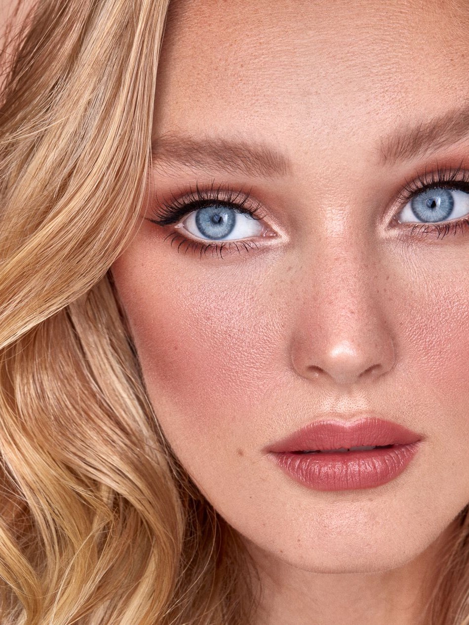 Close-up editorial portrait with soft makeup and SWEED lashes