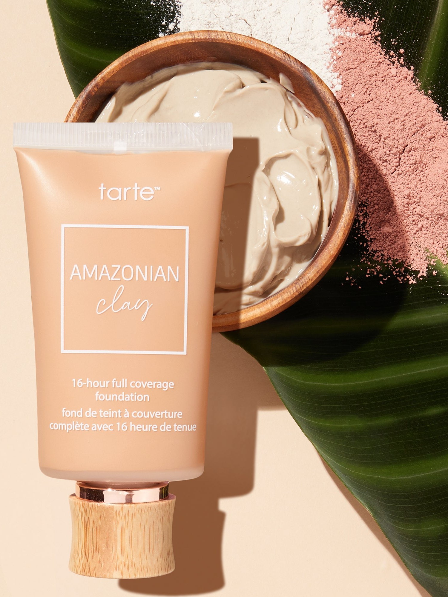 Tarte Amazonian clay foundation tube with a clay bowl and palm leaf