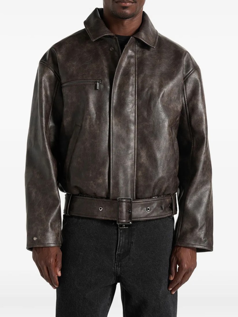Ezra in brown leather belted bomber jacket