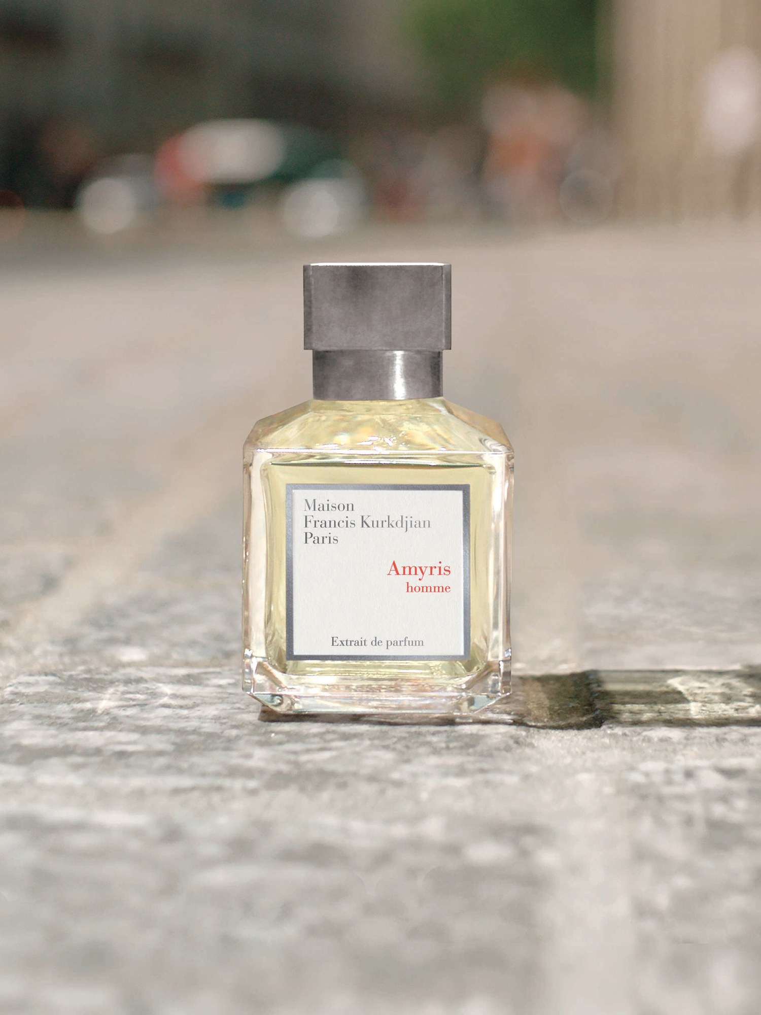 Amyris homme bottle on a Paris pavement