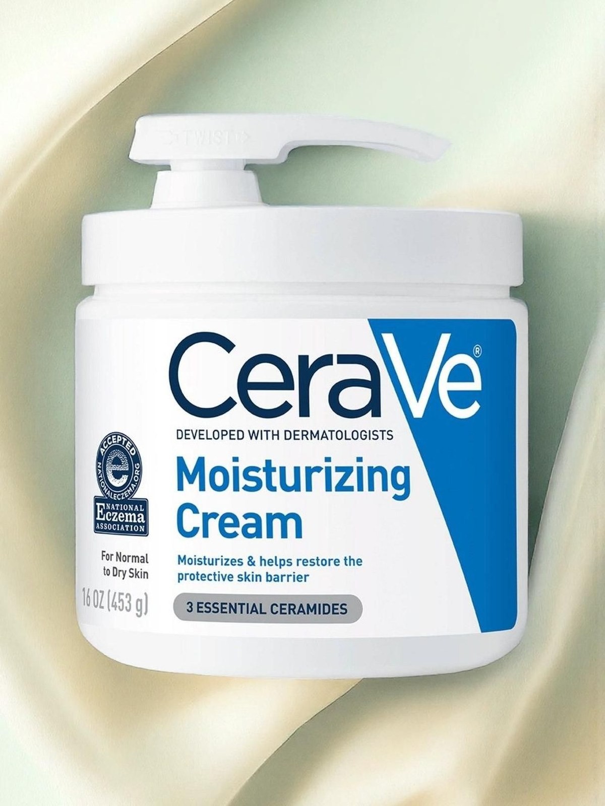 CeraVe Moisturizing Cream pump jar photographed against draped cream fabric
