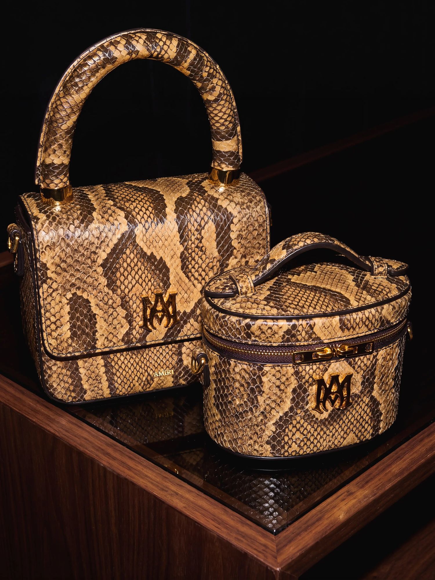 Python print leather micro bags on a dark wooden shelf