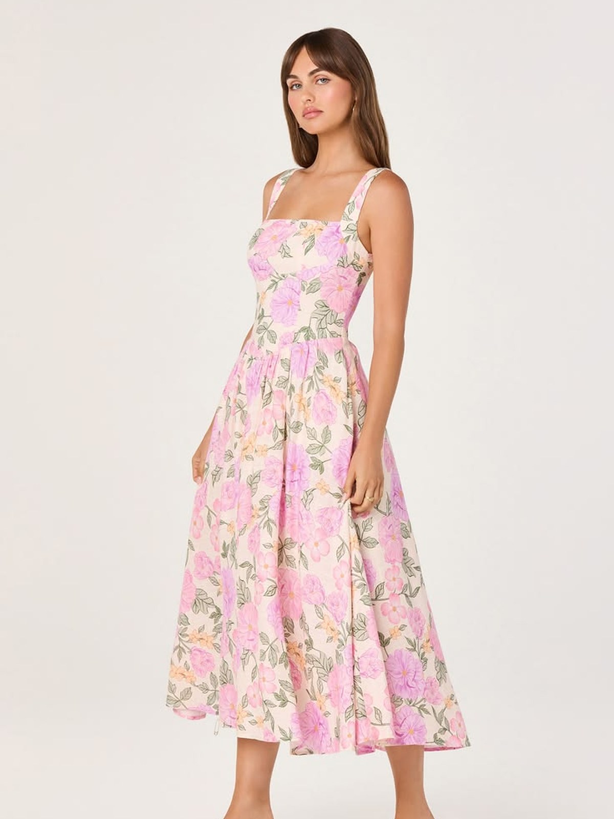 Model in a pink floral midi dress