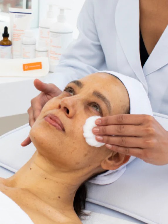 Woman receiving a professional facial treatment