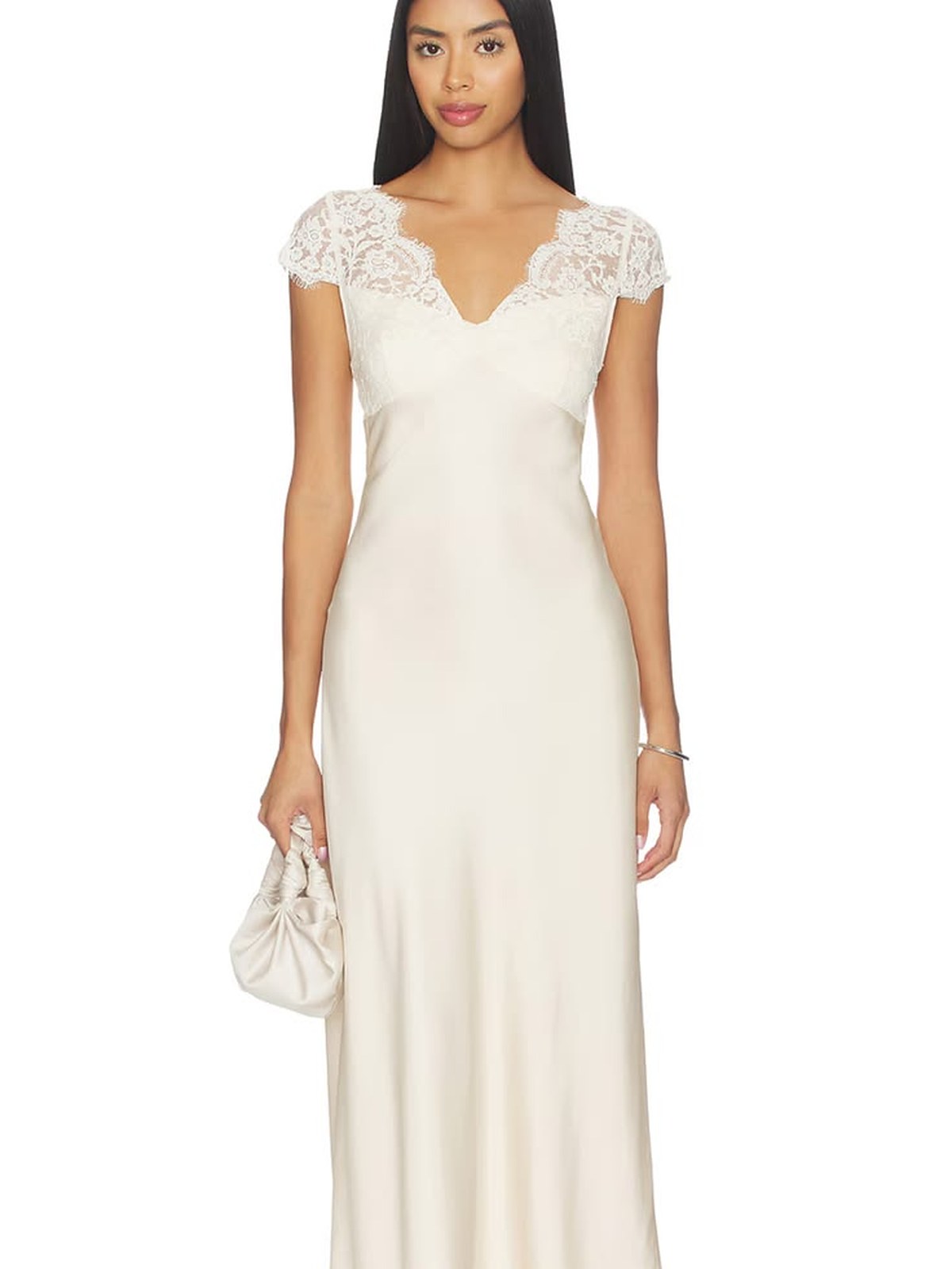 Model in an ivory slip dress with lace trim