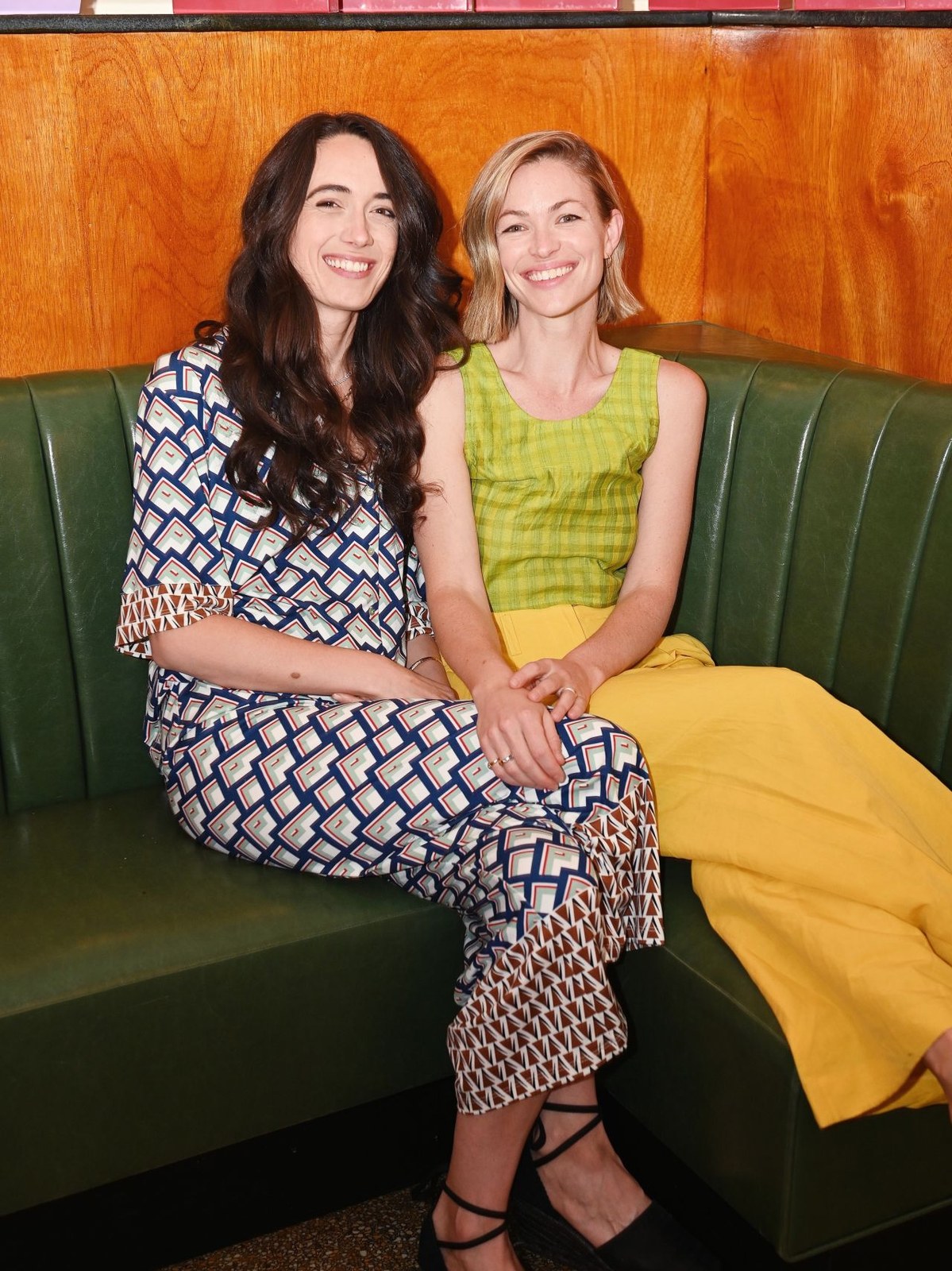 Piecework cofounders Rachel Hochhauser and Jena Wolfe seated together at a launch event