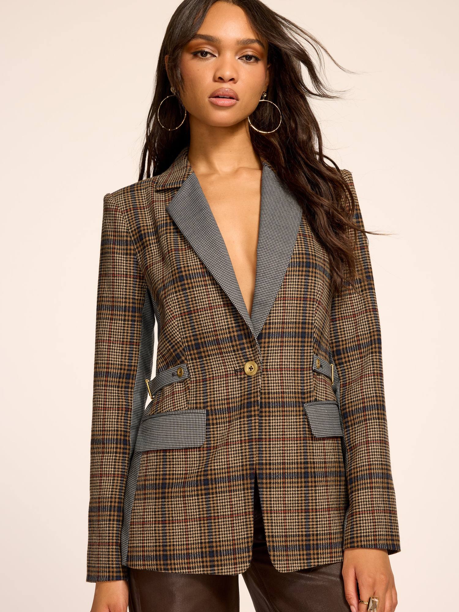 Model in a plaid blazer with leather pants