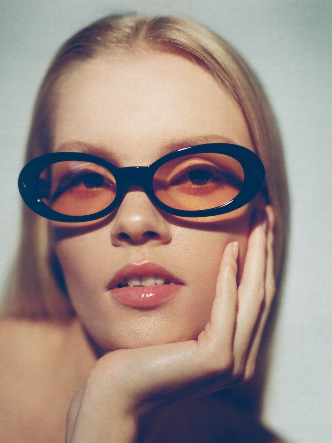 Close-up portrait in warm-toned Lexxola sunglasses