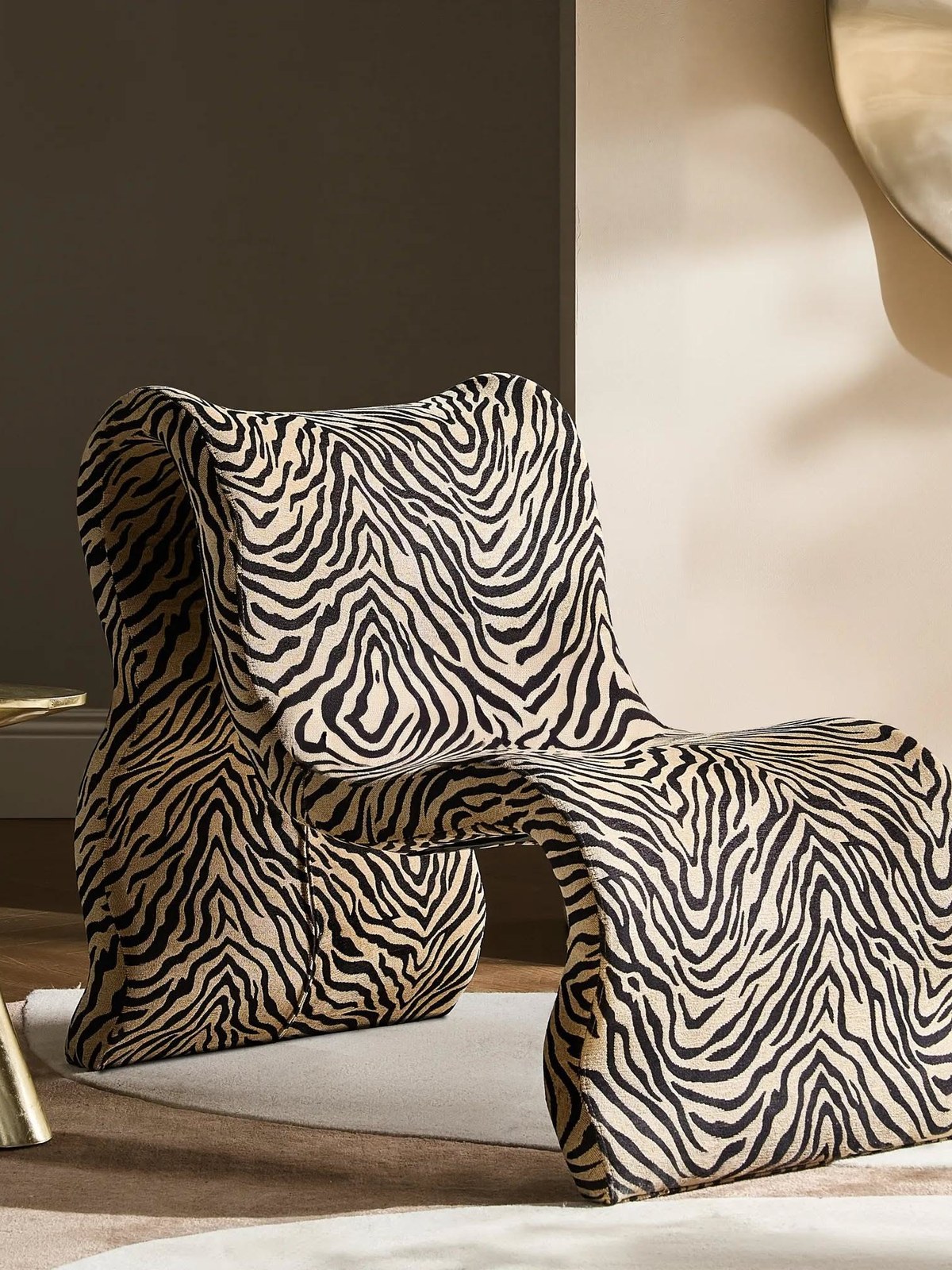 Sculptural zebra print accent chair