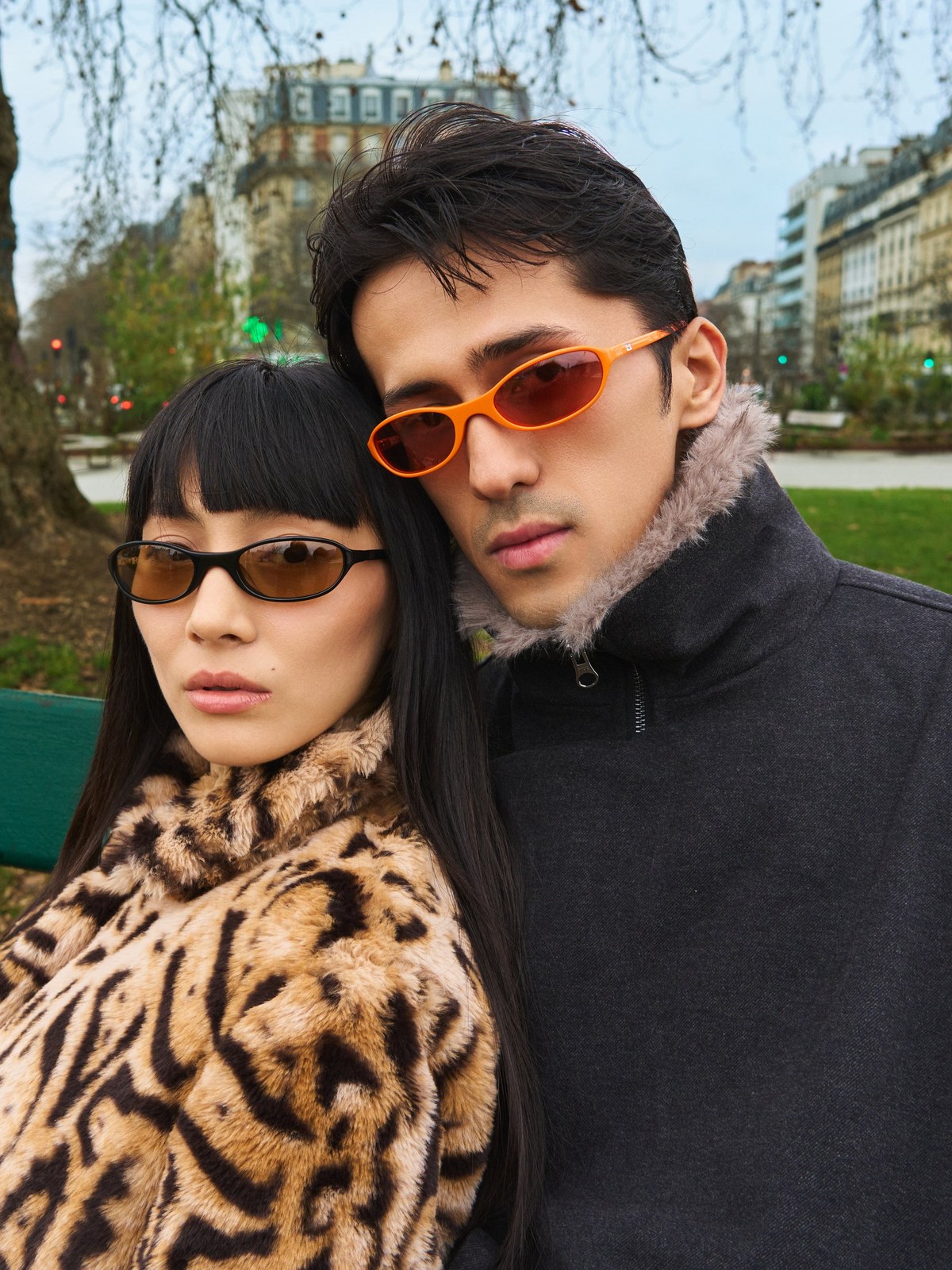 Two people wearing BRU sunglasses together in a Paris park