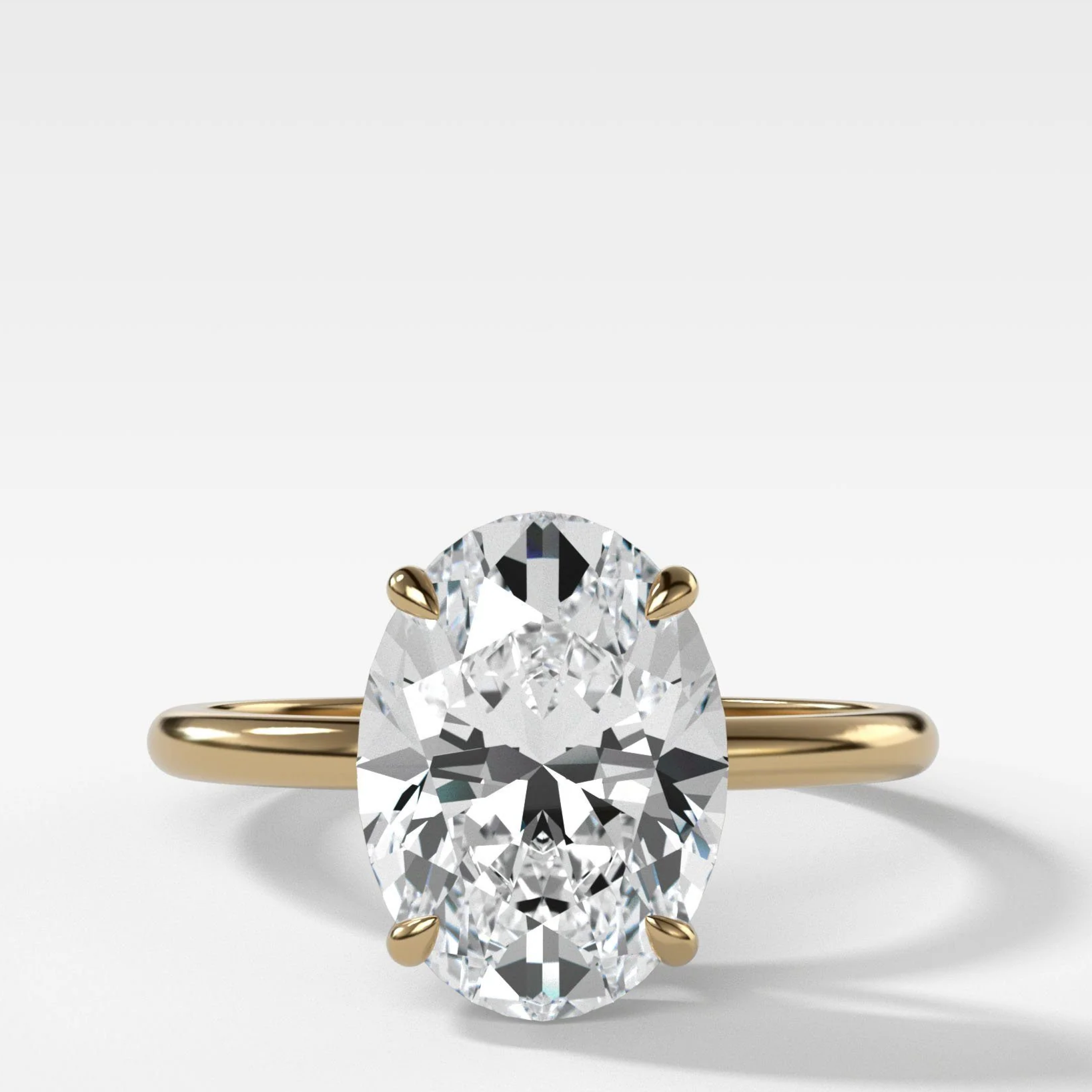 Thin + Simple Solitaire Engagement Ring With Oval Cut Diamond