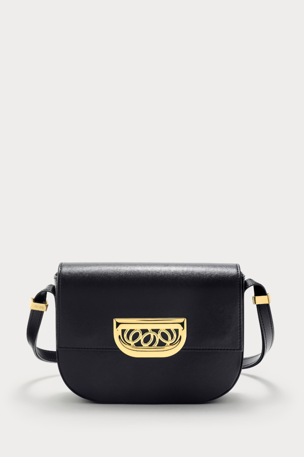 Black leather crossbody bag with golden clasp