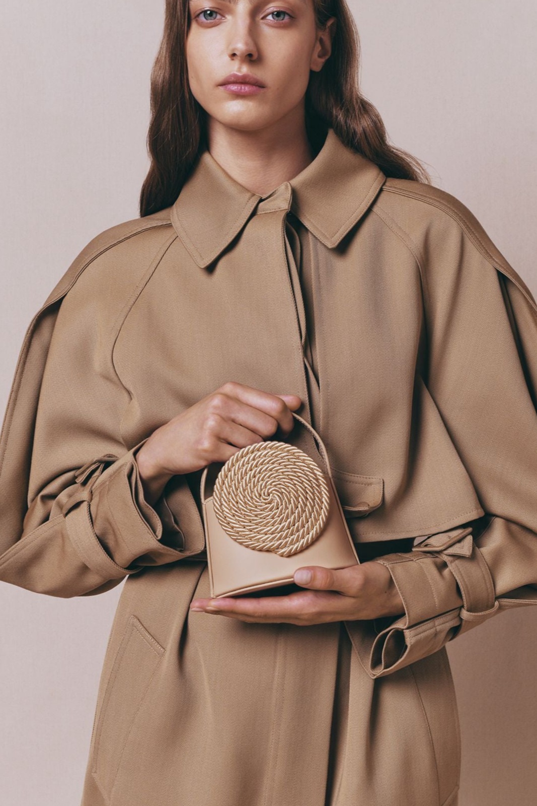 Beige leather mini bag with passementerie details